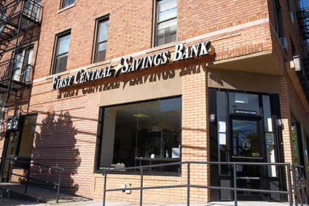 Picture of the exterior of First Central Savings Bank's Ditmars Branch. First Central Savings Bank outdoor sign shown.